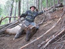 hunter with his bull elk