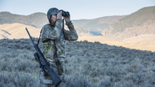 hunter looking in binoculars for her animal Lope hunt October 2015