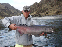 man holding a large Fall chinook