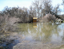 cedar_draw_vault_outhouse_flooded_during_spring_high_flows_on_the_snake_river