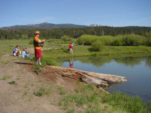 wide shot of kids fishing on Free Fishing Day June 2003