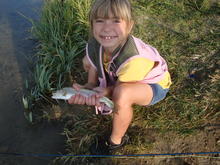 child with rainbow trout