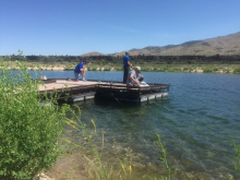 Edson Fichter Community Fishing Pond anglers fishing from a dock medium shot June 2015