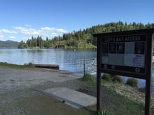 Loffs Bay Access informational sign boat ramp and dock access on Lake Coeur d 'alene medium shot May 2016