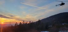 Helicopter in flight for elk captures in North Idaho.