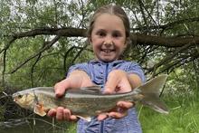 Angler Akeley Fahnholz with her new state record chiselmouth