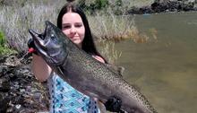 angler holding chinook salmon