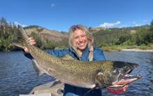 angler holding chinook salmon