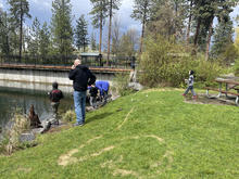 People fishing at Post Falls Park Pond in North Idaho