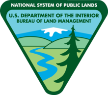 Bureau of Land Management logo which features graphics of pine trees, and winding river, and a snow-capped mountain in the distance.