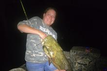 Brandi Holt holding 44-inch flathead catfish from Snake River (horizontal)