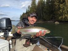 Angler with trout on Clark Fork River