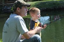 young angler with father