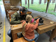 Young girl shooting a rifle at the Farragut Shooting Range Center