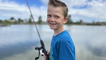 Smiling Kid Fishing