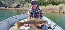 Man holding a large rainbow trout