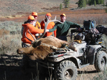 motorized use hunters with a bull elk on a four wheeler ATV October 2003