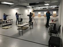 Four air gun shooters aim at targets at the Nampa Public Shooting Range