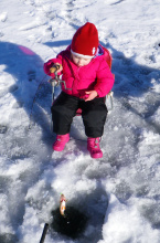 young girl catching her perch during Youth Ice Fishing Day January 2011