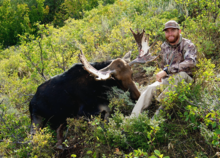 man with his bull moose from the Superhunt March 2015