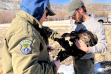 guthrie_and_john_nalley_banding_a_hen_turkey_prior_to_release_big_cottonwood_wma_feb_2022