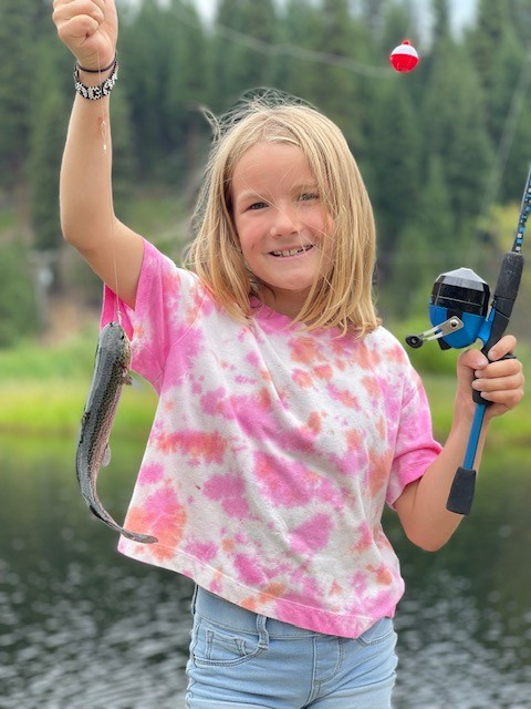 Rainbow trout caught by child