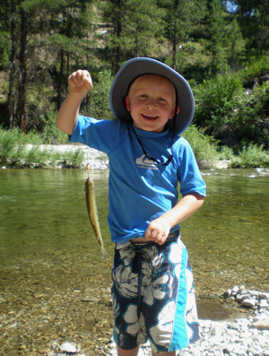 Alex with his first fish / Photo by Brenda Beckley